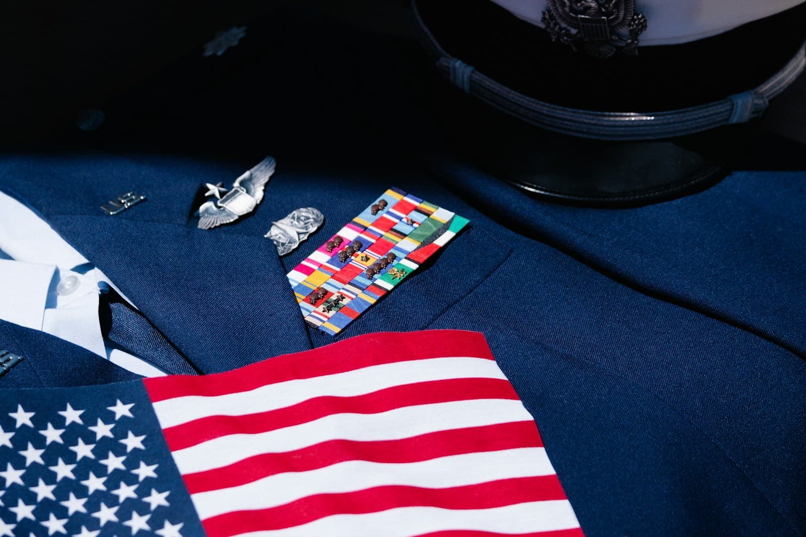 American flag and small flag-themed cards arranged on a dark blue surface